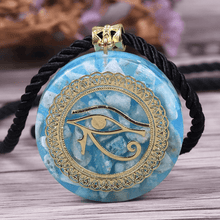 Load image into Gallery viewer, An orgonite pendant necklace with Amazonite stones and a copper "Eye of Horus" energy patch.