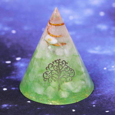 An orgonite cone with a quartz crystal in a copper energy coil. Features a copper foil Tree of Life energy patch and gold foil shavings.