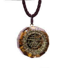 Load image into Gallery viewer, Orgonite necklace with Tiger's Eye and gold Sri Yantra emblem.