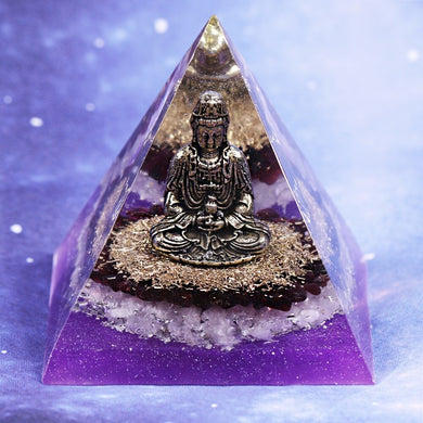 Orgonite pyramid with Rose Quartz crystals, gold foil shavings and a Buddha statue. 