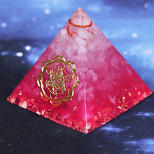 Load image into Gallery viewer, A vibrant pink orgonite pyramid with quartz crystals and a quartz-copper energy coil. Features a copper Metatron's Cube energy patch and gold foil shavings.