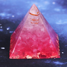 Load image into Gallery viewer, Rear view of a vibrant pink orgonite pyramid with quartz crystals and a quartz-copper energy coil. Features a copper Metatron's Cube energy patch and gold foil shavings.