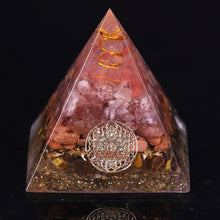 Load image into Gallery viewer, An orgonite pyramid with Strawberry Quartz, Tiger's Eye and Goldstone crystals. Features a Quartz crystal set in a Copper Energy Coil and Flower of Life copper energy patch.