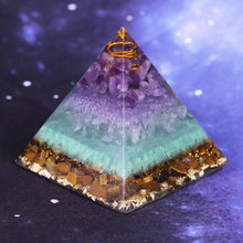 Load image into Gallery viewer, Orgonite pyramid with Tiger's Eye, Amethyst and Fluorite crystals. Includes a quartz crystal in a copper energy coil, gold foil shavings and a sacred Flower of Life energy patch.