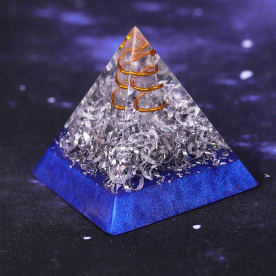 An orgonite pyramid with Quartz crystal in a copper energy spire, and aluminum shavings.