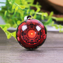 Load image into Gallery viewer, A red orgonite necklace with a Lotus flower design. Orgonite pendant contains Red coral, Red Sea Glass, Resin, Gold Foil