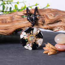 Load image into Gallery viewer, Mermaid's Tale orgonite necklace with obsidian and howlite stones from The Orgone Shop.