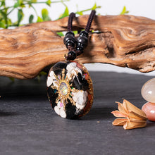 Load image into Gallery viewer, Mermaid's Tale orgonite necklace with obsidian and howlite stones from The Orgone Shop.
