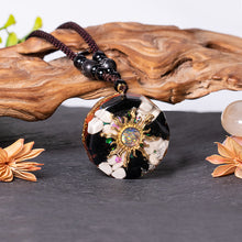 Load image into Gallery viewer, Mermaid's Tale orgonite necklace with obsidian and howlite stones from The Orgone Shop.