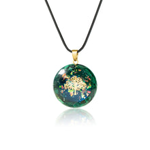Load image into Gallery viewer, Iridescent orgonite necklace with a gold tree of life, surrounded by malachite stones from The Orgone Shop.