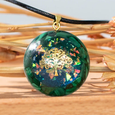 Iridescent orgonite necklace with a gold tree of life, surrounded by malachite stones from The Orgone Shop.