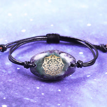 Load image into Gallery viewer, Orgonite bracelet with Amethyst stones surrounding a central cluster of Green Aventurine stones. Features silver foil shavings and a Sri Yantra energy patch.