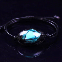 Load image into Gallery viewer, An orgonite bracelet that resembles a galaxy, with Obsidian surrounding a single Turquoise stone.