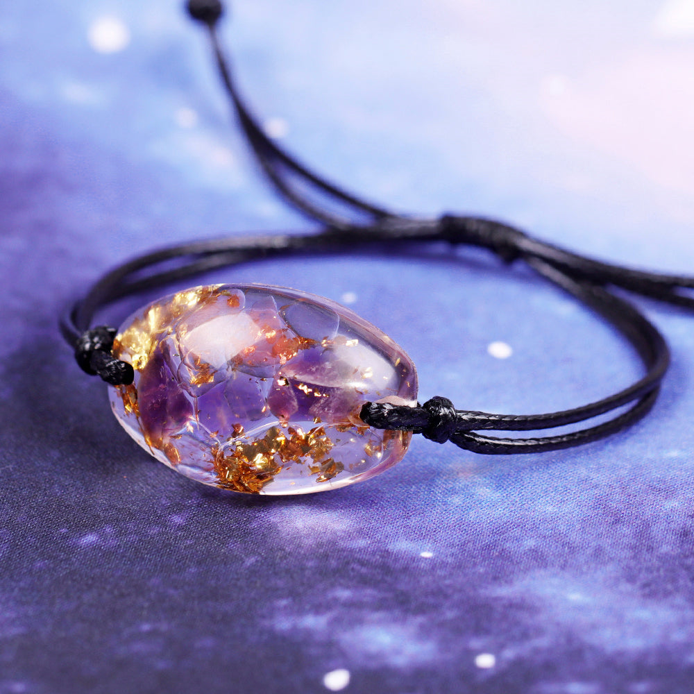 Orgonite bracelet with Amethyst crystals and Gold Foil shavings sold at The Orgone Shop.