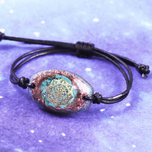 Load image into Gallery viewer, Orgonite bracelet with Turquoise stones surrounded by copper shavings. Features a central Sri Yantra energy patch.