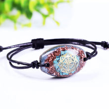 Load image into Gallery viewer, Orgonite bracelet with Turquoise stones surrounded by copper shavings. Features a central Sri Yantra energy patch.