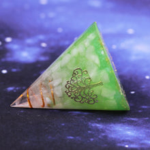 Load image into Gallery viewer, An orgonite cone with a quartz crystal in a copper energy coil. Features a copper foil Tree of Life energy patch and gold foil shavings.