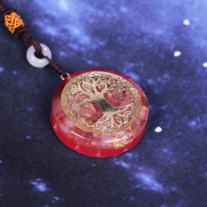 Orgonite Necklace with Rose Quartz and gold Tree of Life emblem.