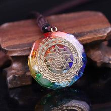 Load image into Gallery viewer, An orgonite necklace with seven stones and a copper Sri Yantra energy patch.