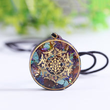 Load image into Gallery viewer, Orgonite necklace with Turquoise and Tigers Eye crystals. The orgonite pendant has a copper foil energy patch with the Sri Yantra emblem.