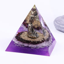 Load image into Gallery viewer, Orgonite pyramid with Rose Quartz crystals, gold foil shavings and a Buddha statue. 