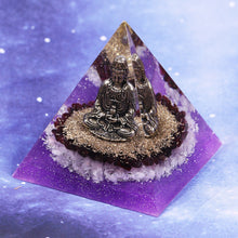 Load image into Gallery viewer, Orgonite pyramid with Rose Quartz crystals, gold foil shavings and a Buddha statue. 