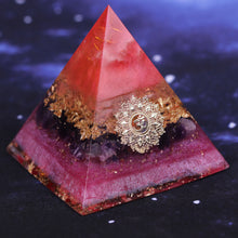 Load image into Gallery viewer, Orgonite pyramid with Amethyst and Quartz crystals. Features a Lotus Flower and Aum copper energy patch.