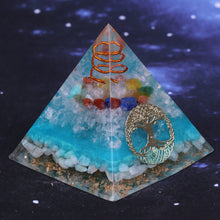 Load image into Gallery viewer, Sky blue orgonite pyramid with seven crystal stones. Features a quartz and copper energy coil, with a copper Tree of Life energy patch.