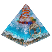 Load image into Gallery viewer, Sky blue orgonite pyramid with seven crystal stones. Features a quartz and copper energy coil, with a copper Tree of Life energy patch.