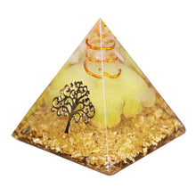 Load image into Gallery viewer, An orgonite pyramid with Quartz and Yellow Agate crystals. Features quartz in a copper energy coil, a Tree of Life energy patch and gold foil shavings.