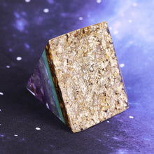 Load image into Gallery viewer, Orgonite pyramid with Tiger&#39;s Eye, Amethyst and Fluorite crystals. Includes a quartz crystal in a copper energy coil, gold foil shavings and a sacred Flower of Life energy patch.