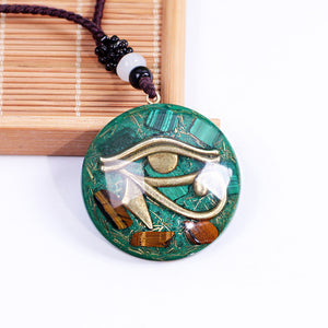 Orgonite necklace with Malachite and Tigers Eye. Features the Eye of Horus.