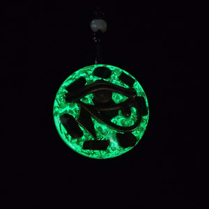 Orgonite necklace with Malachite and Tigers Eye. Features the Eye of Horus. Glowing in the dark.