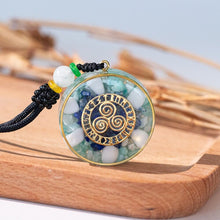 Load image into Gallery viewer, Orgonite pendant necklace with Amazonite and Lapis Lazuli stones and a Triskelion energy patch.