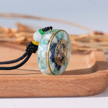 Load image into Gallery viewer, Orgonite pendant necklace with Amazonite and Lapis Lazuli stones and a Triskelion energy patch.