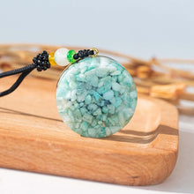 Load image into Gallery viewer, Rear view of an orgonite pendant necklace with Amazonite  stones.