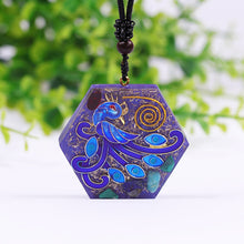 Load image into Gallery viewer, An orgonite necklace with a blue phoenix design. 