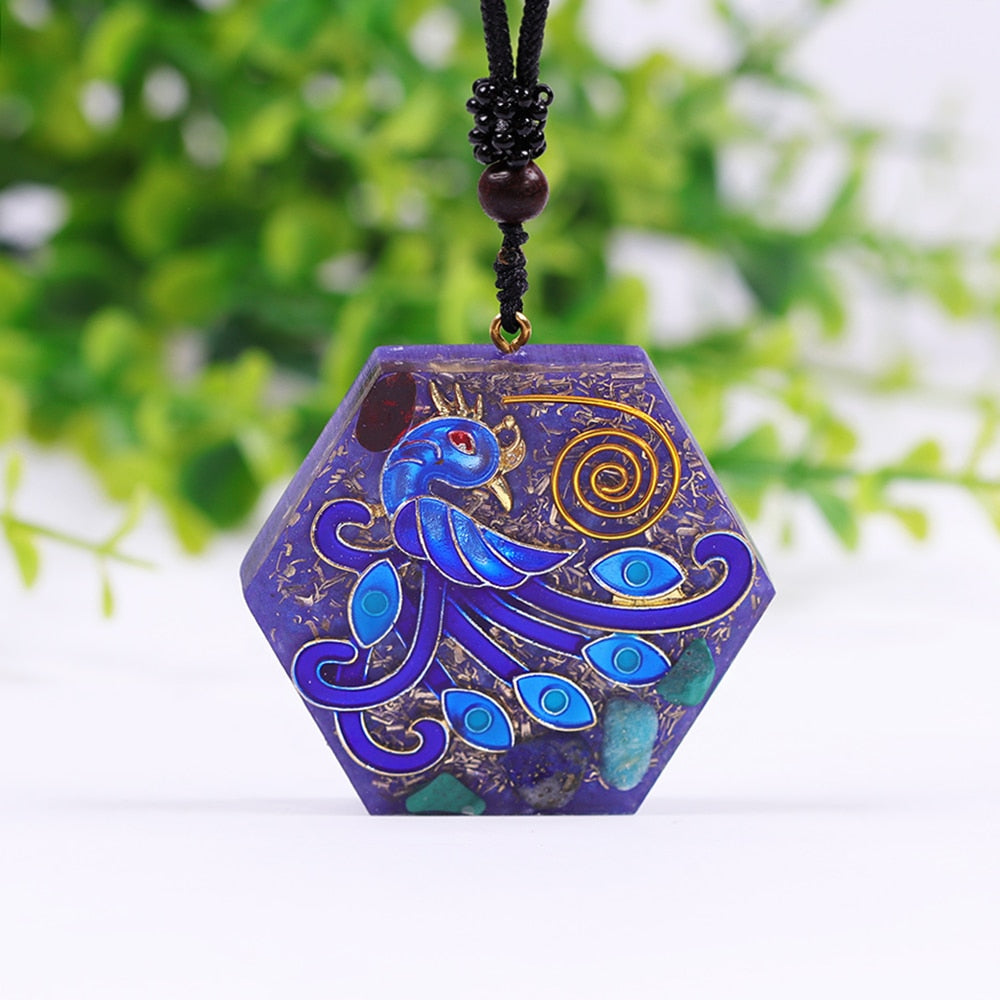 An orgonite necklace with a blue phoenix design. 