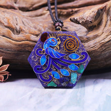 Load image into Gallery viewer, An orgonite necklace with a blue phoenix design. 