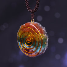 Load image into Gallery viewer, Orgonite pendant necklace with six types of crystal, silver foil shavings and a spiral copper energy coil.