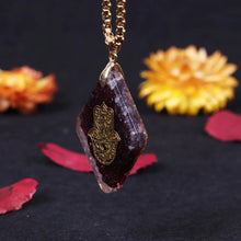 Load image into Gallery viewer, Orgonite pendant necklace with garden stones and a copper Hamsa energy patch.