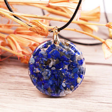 Load image into Gallery viewer, Rear view of an orgonite pendant necklace with Lapis Lazuli stones.