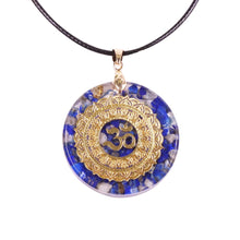 Load image into Gallery viewer, An orgonite pendant necklace with Lapis Lazuli stones and a copper Aum energy patch.