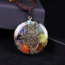 Load image into Gallery viewer, Orgonite pendant necklace with seven stones and a copper Hamsa energy patch.