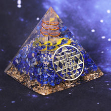 Load image into Gallery viewer, An orgonite pyramid with Lapis Lazuli &amp; Quartz crystals. Includes a Sri Yantra and Aum copper energy patch.