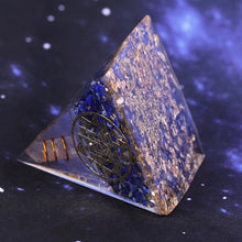 Load image into Gallery viewer, An orgonite pyramid with Lapis Lazuli &amp; Quartz crystals. Includes a Sri Yantra and Aum copper energy patch.