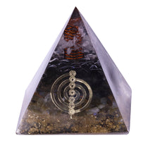 Load image into Gallery viewer, Orgonite pyramid with obsidian, labradorite and quartz crystals. Features a seven chakra copper energy patch and gold foil shavings.