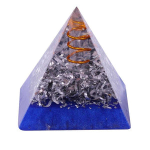 An orgonite pyramid with Quartz crystal in a copper energy spire, and aluminum shavings.