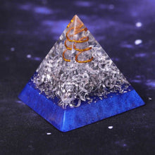 Load image into Gallery viewer, An orgonite pyramid with Quartz crystal in a copper energy spire, and aluminum shavings.