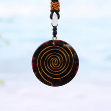 Load image into Gallery viewer, Rear view of red orgonite necklace with copper orgone energy accumulator.